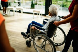 Senior Sitting in a Wheelchair in a Care Home