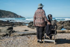 elderly women enjoying the heat by the beach